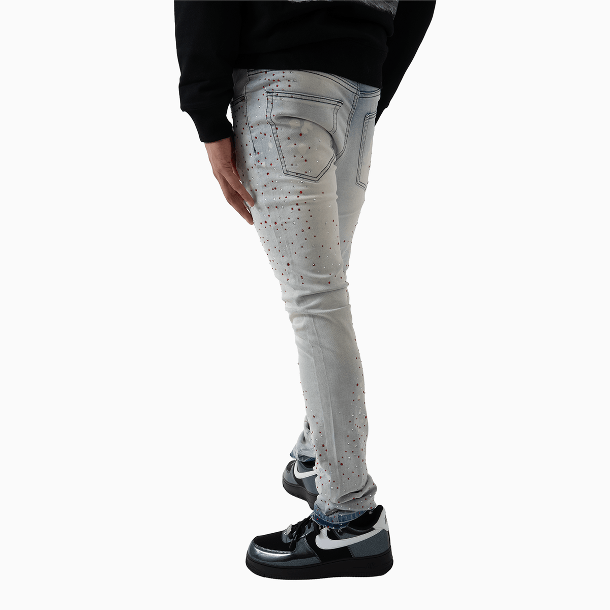 Pantalón vaquero de hombre con piedra rosa