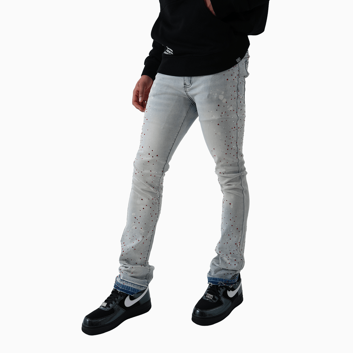 Pantalón vaquero de hombre con piedra rosa